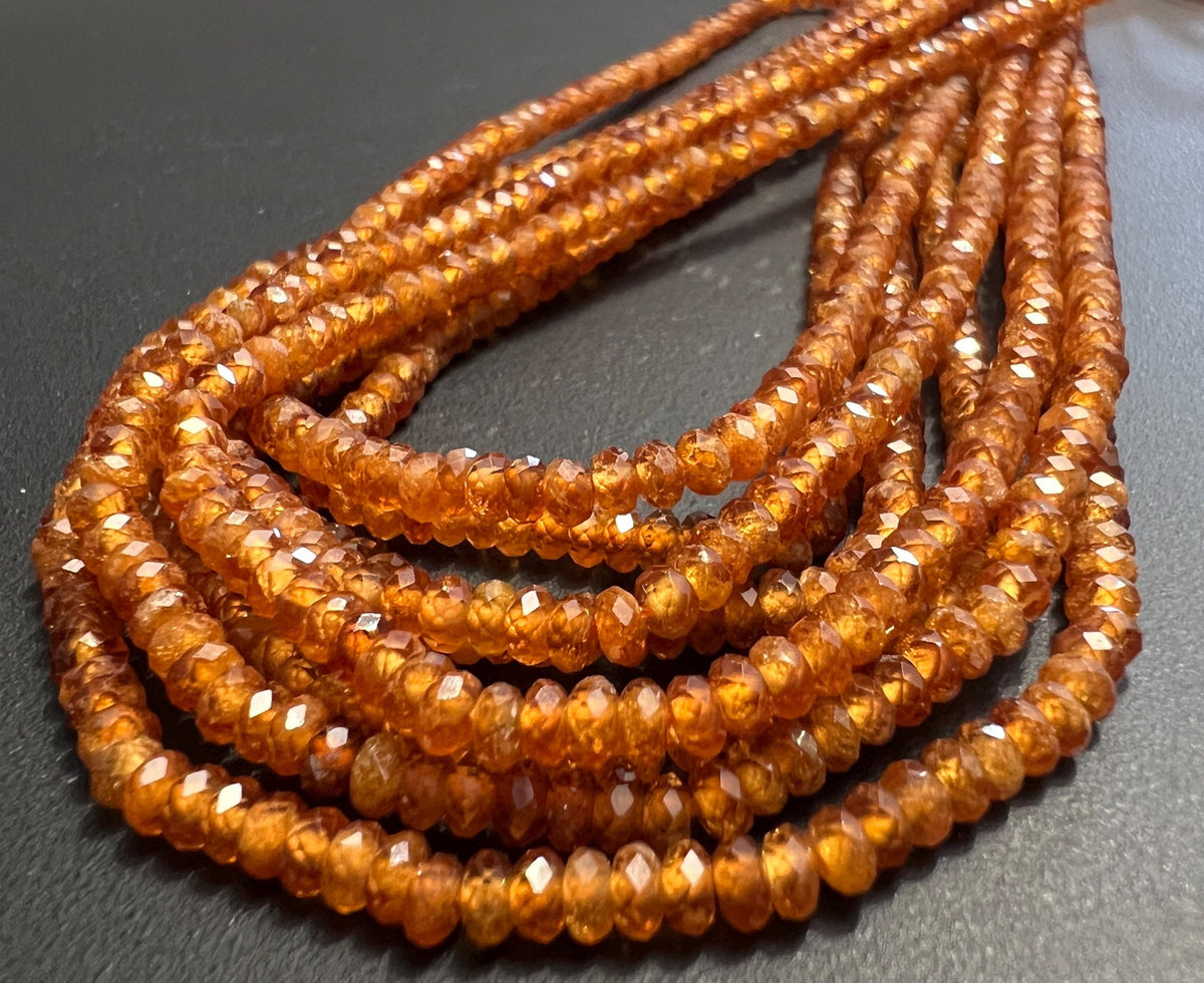 Hessonit / Granat Knöpfe Strang, facettiert, 3 mm | S55