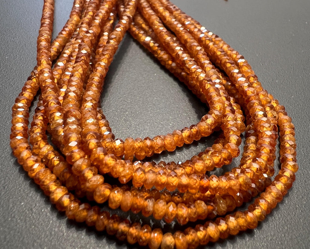 Hessonit / Granat Knöpfe Strang, facettiert, 3 mm | S55